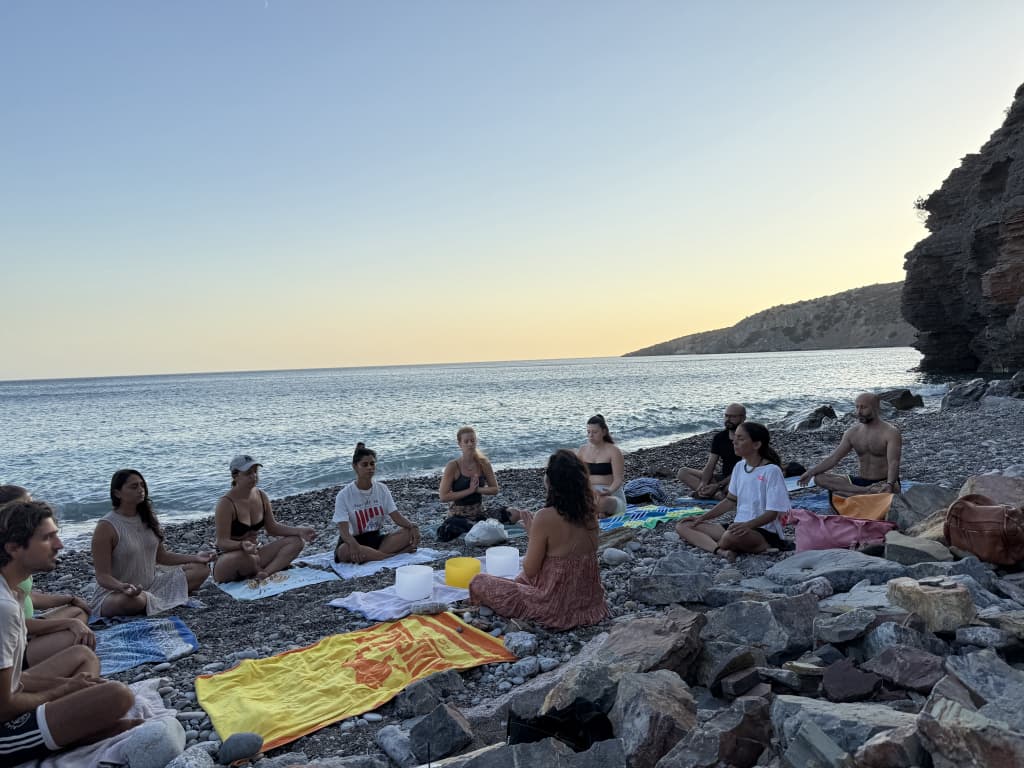 Meditation and sound bath on a pebble beach in Greece, 2025